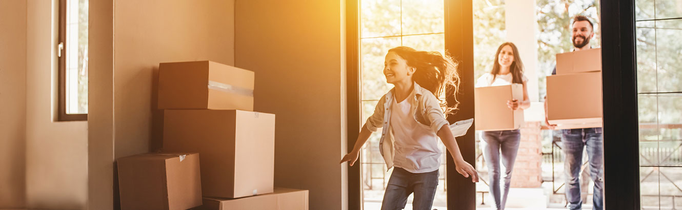 Daughter, mother, and father moving into their new house.